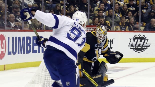Oct 15, 2022; Pittsburgh, Pennsylvania, USA; Pittsburgh Penguins goaltender Tristan Jarry (35) makes a save against Tampa Bay Lightning center Steven Stamkos (91) during the third period at PPG Paints Arena. The Penguins won 6-2. Mandatory Credit: Charles LeClaire-USA TODAY Sports